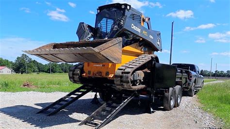 best way to load skid steer on trailer|how to load a skid steer.